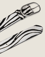 FRONT SHOT OF THE EVERYDAY SIGNATURE BEILT IN ZEBRA FEATURING THE SILVER HARDWARE AND END OF BELT CLOSURE