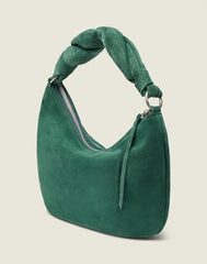 Side shot of the Crescent Bag In Green Suede 