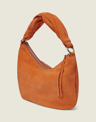 Side shot of the Crescent Bag in Apricot 