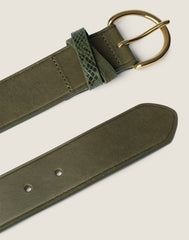 FRONT SHOT OF THE KEEPER IN GREEN FEATURING THE END OF BELT AND THE GOLD HARDWARE BUCKLE
