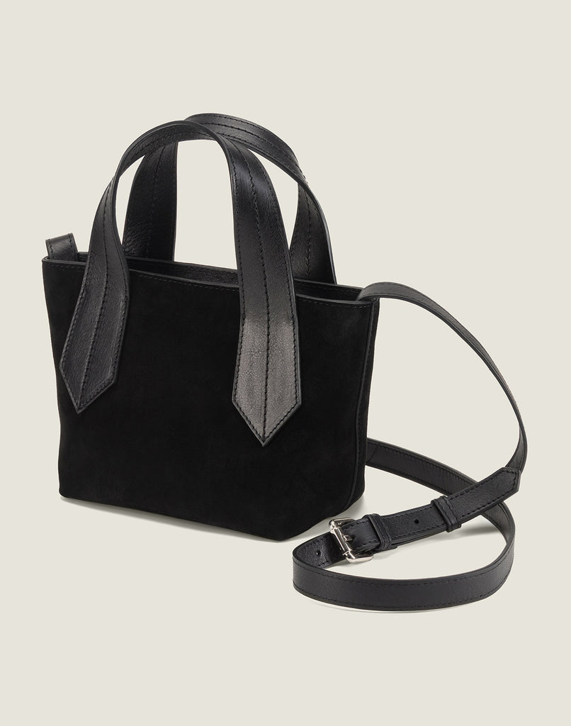 SIDE SHOT OF THE TAB TOTE MINI IN BLACK SUEDE AND CROSSBODY STRAP