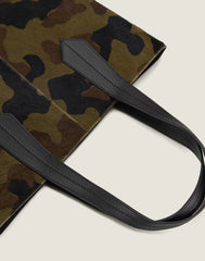 LEATHER HANDLE SHOT OF THE TAB TOTE IN CAMO HAIR CALF