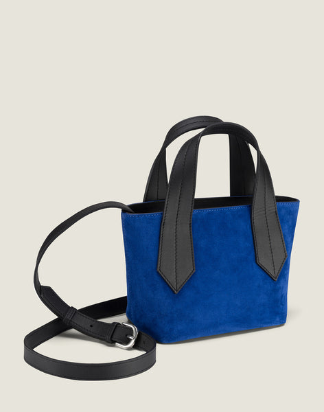 Side shot of Tab Tote Mini in Blue Suede featuring removeable crossbody strap
