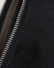 Zip detail shot of black Everyday crossbody
