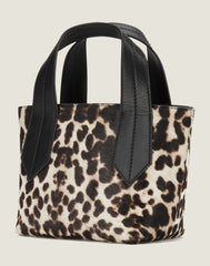 SIDE SHOT OF THE TAB TOTE MINI IN SNOW LEOPARD