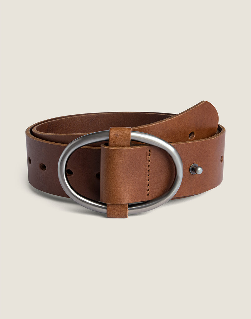 FRONT SHOT OF THE ANY-WEAR BELT IN COGNAC ROLLED FEATURING SILVER HARDWARE
