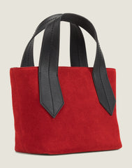 SIDE SHOT OF THE TAB TOTE MINI IN RED SUEDE