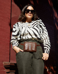 Model wearing Laced Up Zip Top Top Belt Bag in Chocolate